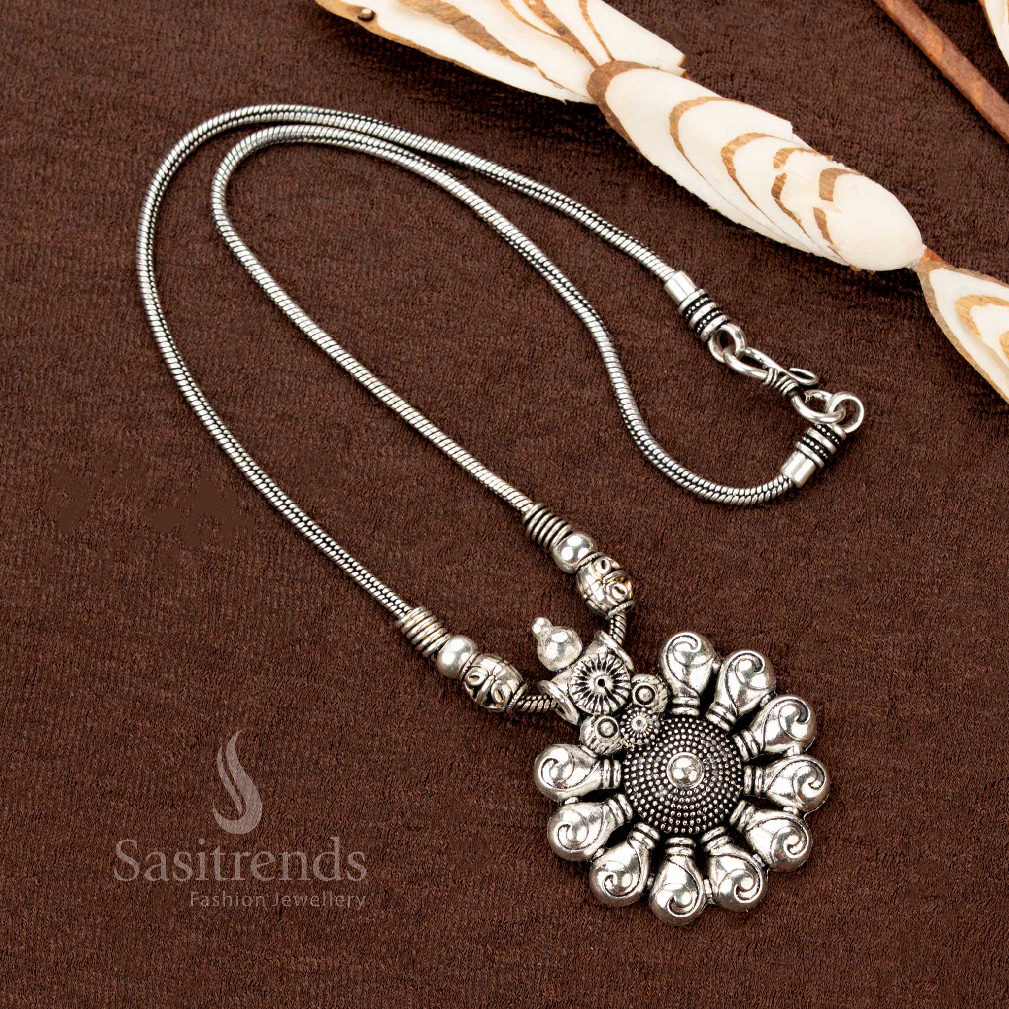 Divine whirl oxidised silver necklace showcasing a striking floral spiral pendant with dainty beaded details—a unique ethnic jewellery treasure crafted for Navaratri and festive traditions - Sasitrends