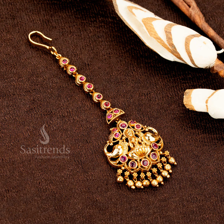 Vintage inspired matte gold Lakshmi peacock floral tikka enhanced with AD sparkle, ideal for ethnic wedding jewellery style perfection -sasitrends
