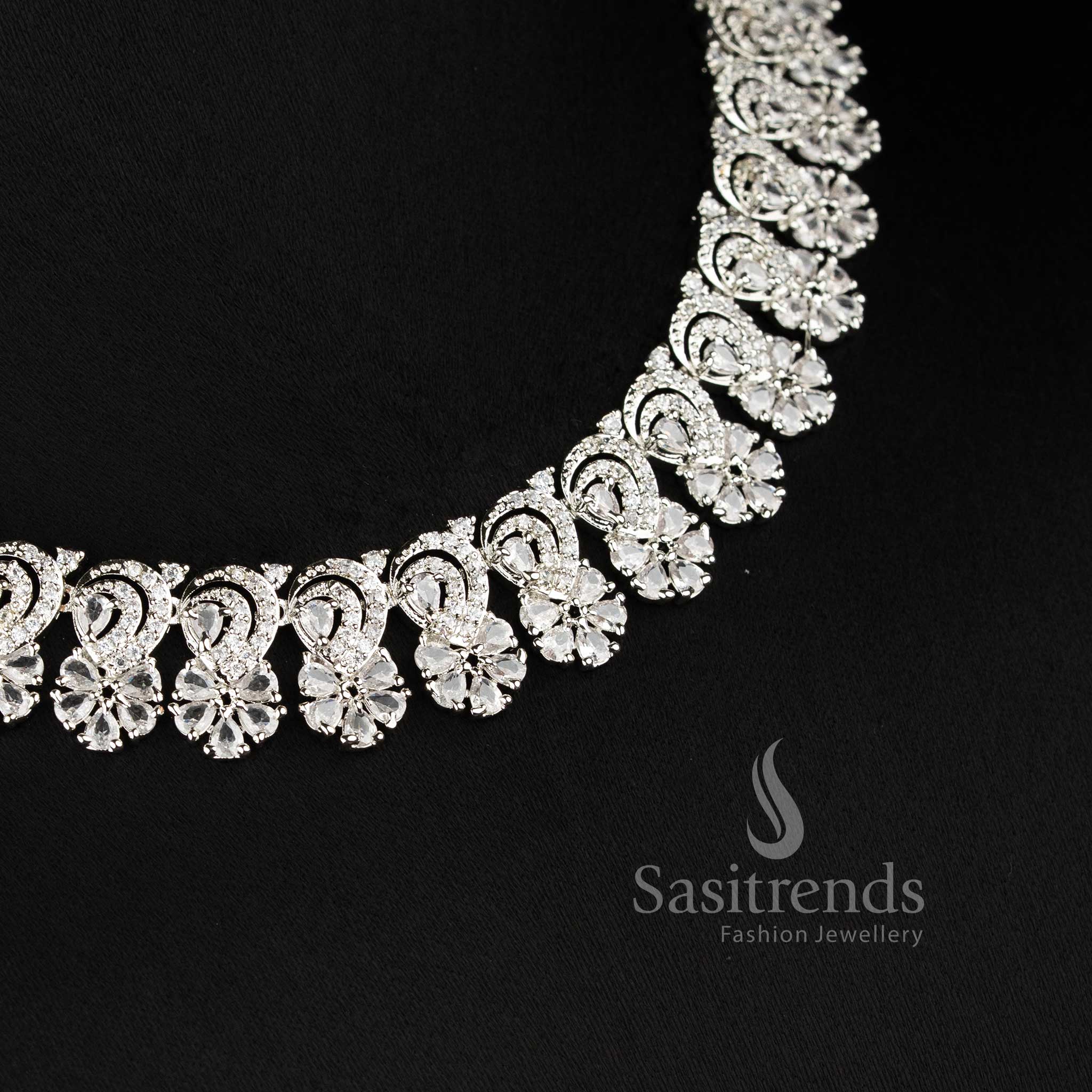 Beautiful white AD stone necklace set with intricate floral pattern and matching earrings for weddings and festive occasions - Sasitrends