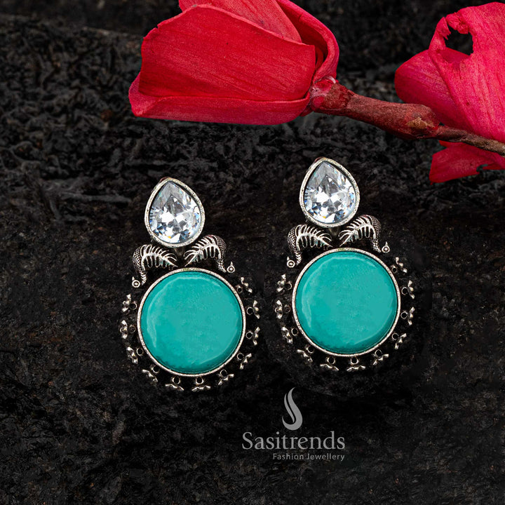 Charming turquoise Monalisa stone earrings in oxidised silver with leaf motif - Sasitrends





