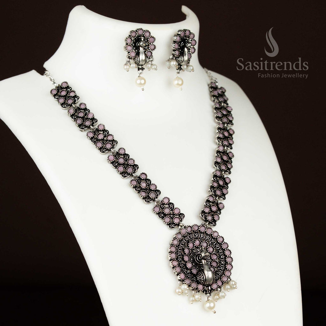 Rosy pink oxidised necklace set with a detailed peacock pendant and pearl drops – trendy and artistic ethnic jewellery for festive wear by sasitrends