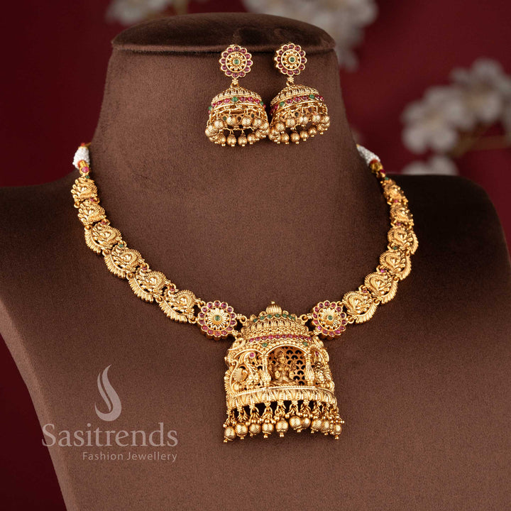 Traditional temple jewellery bridal set featuring Nakshi carving Lakshmi and peacock choker necklace in ruby green color combination
