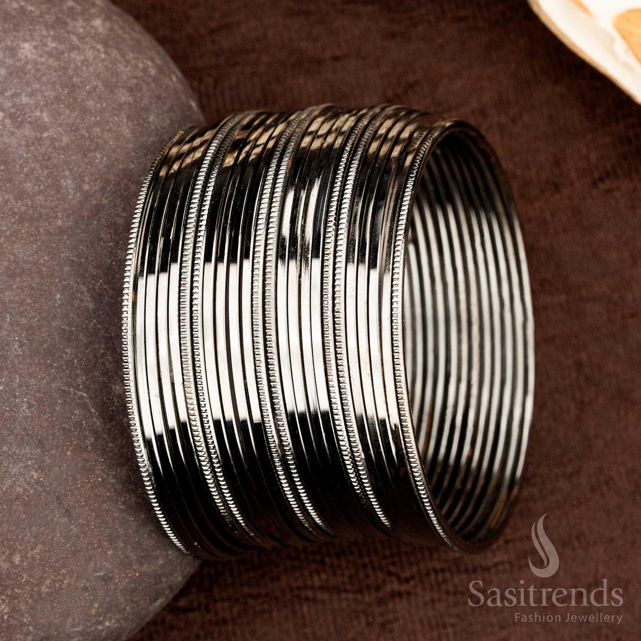 Elegant oxidised black finish bangles set featuring classic simplicity and a subtle traditional flair, specially created for daily ethnic jewellery style and effortless festive dressing by Sasitrends