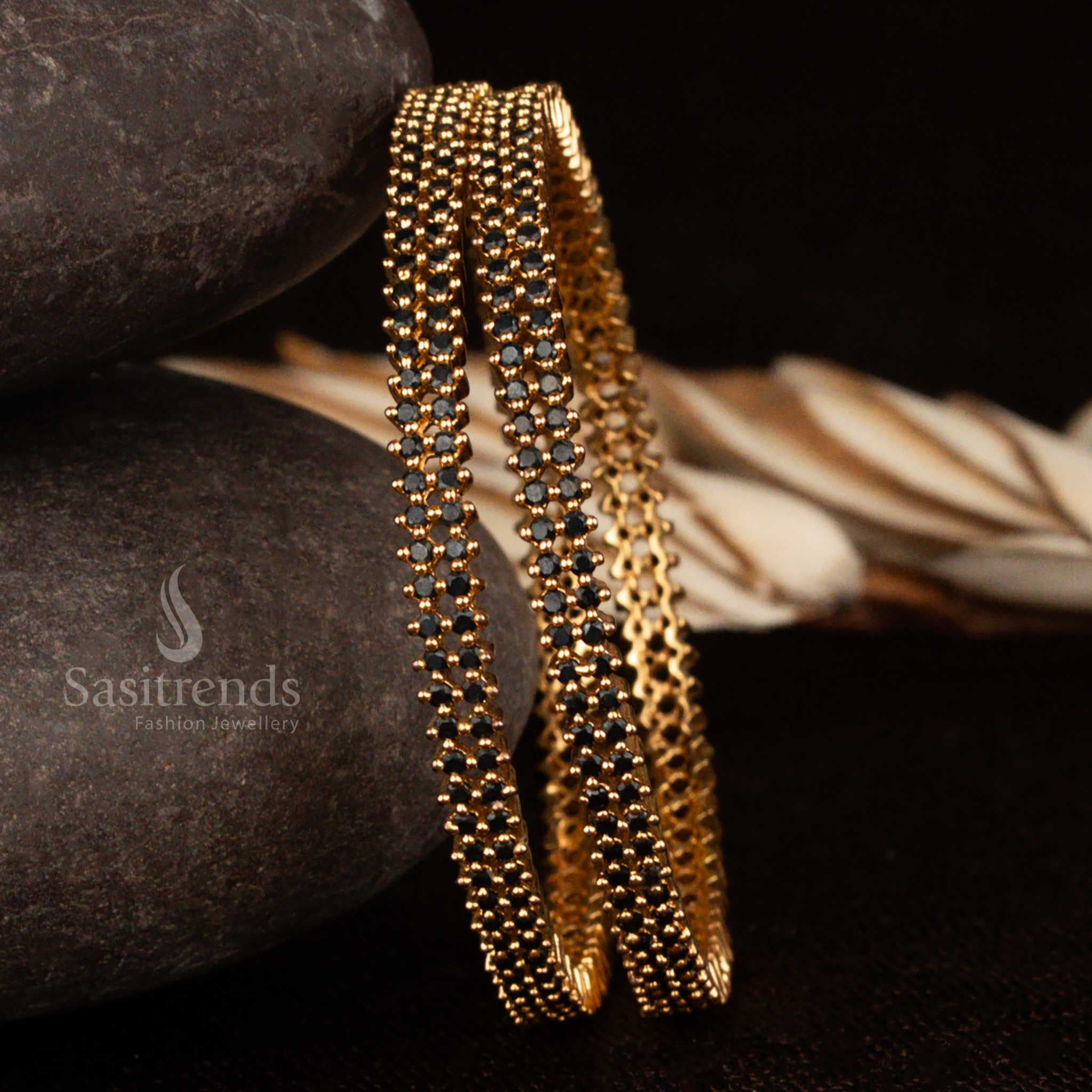 Elegant black stone American diamond bangles with micro gold plating, exuding unique grace and modern ethnic flair, backed by a 1-year guarantee from Sasitrends
