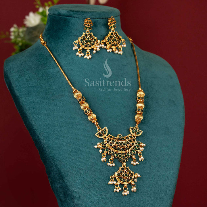 Temple-style matte gold pendant necklace with leaf green accents, sculpted deity motif and floral ethnic detailing for festive and traditional looks – Sasitrends
