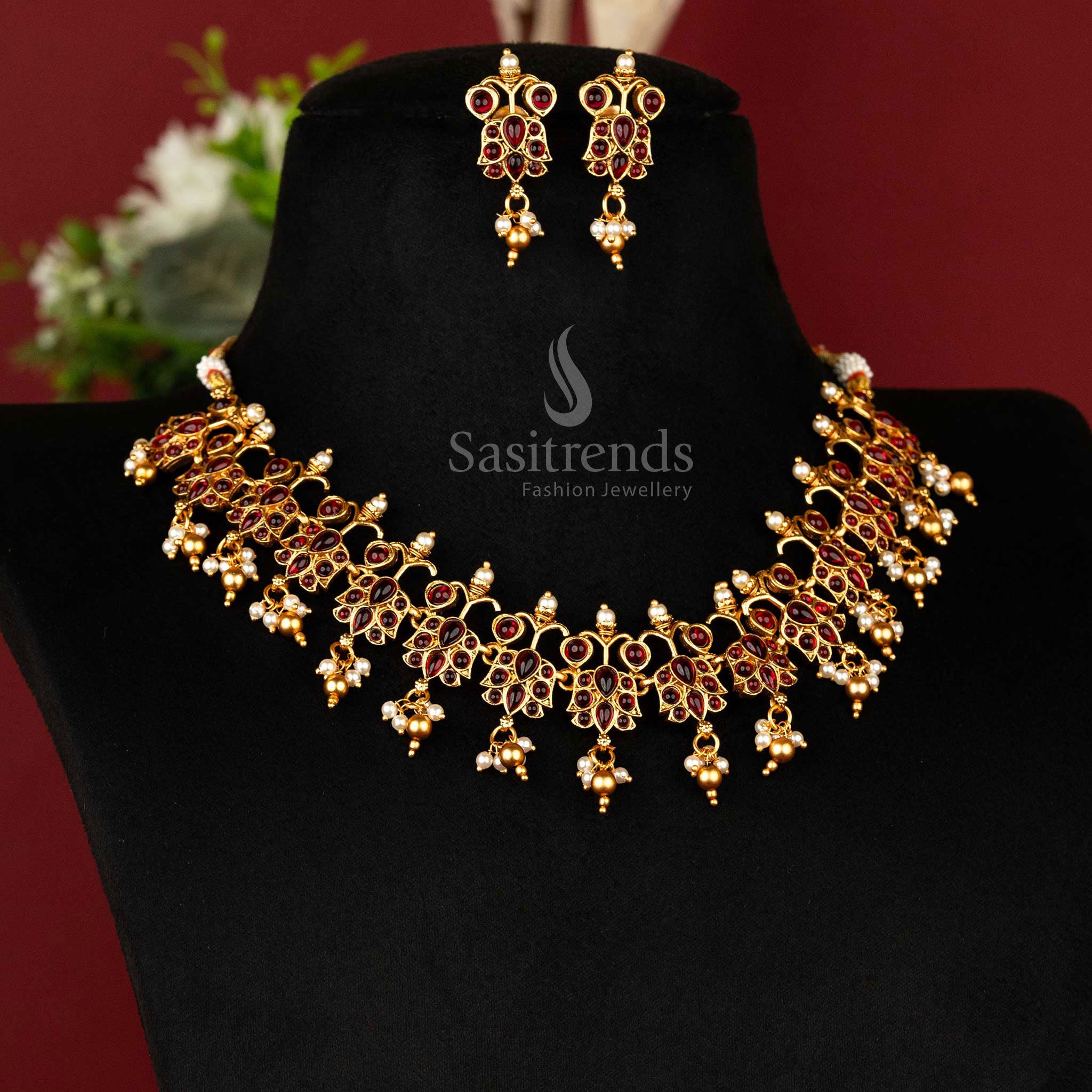 Regal matte gold plated temple necklace set with classic ruby Kemp stones and beautifully crafted earrings – perfect traditional festive jewellery – sasitrends
