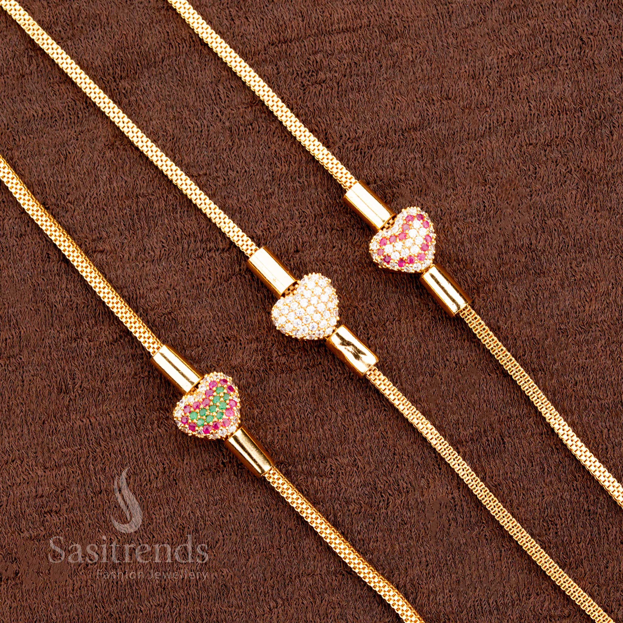 Vibrant multi-hue Mugappu chain with heart design and striking pink stone, finished in micro gold for one gram jewellery lovers – perfect with ethnic sarees – sasitrends