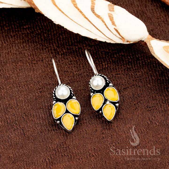 Elegant oxidised silver fish hook earrings adorned with delicate pearl dangles and sunny yellow AD stone drops, perfect for minimalist office glamour and everyday elegance by Sasitrends