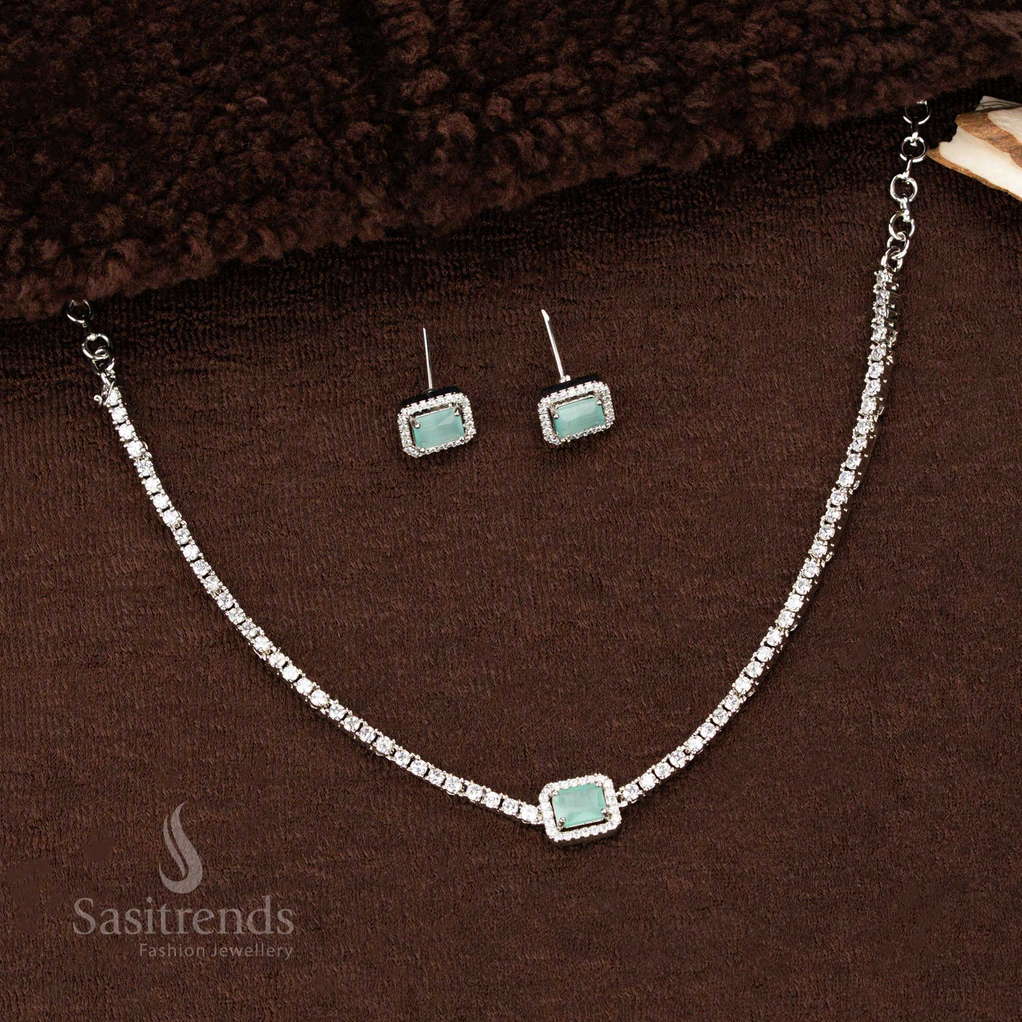 Mint green rectangular American diamond pendant necklace with rhodium-layered shine and sparkling matching earrings – a delicate and unique festive jewellery piece by Sasitrends