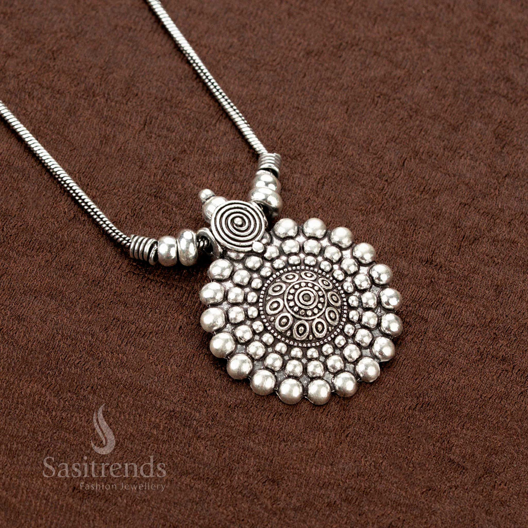 Ethnic glamour radiates from this oxidised chain necklace, highlighting a spiral floral mandala pendant with graceful beaded charms—crafted as a standout Navaratri jewellery adornment - Sasitrends