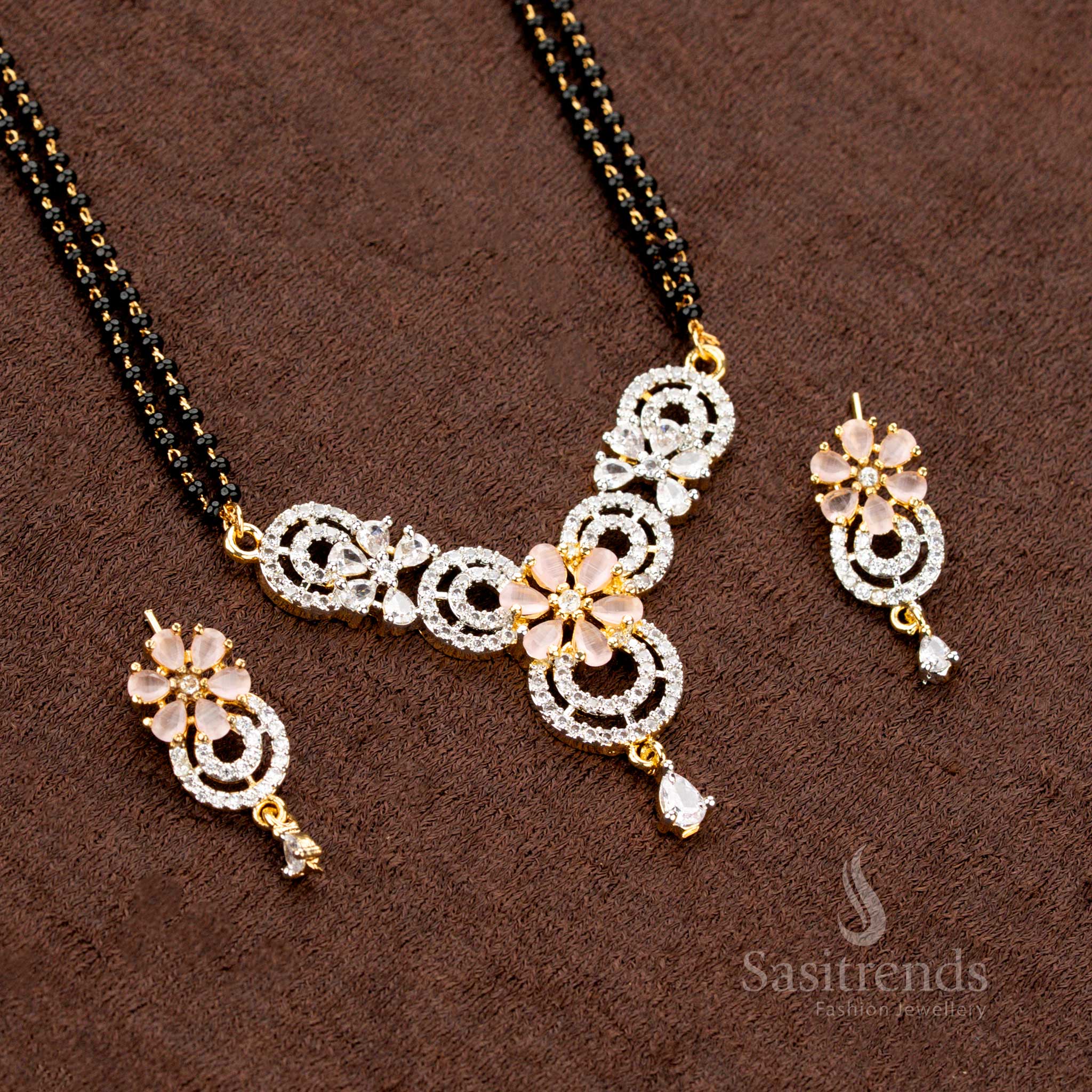 Royal pink AD pendant set featuring a circular floral design, a micro gold plated Mangalsutra chain, and matching earrings, perfect for a luxury jewellery collection - Sasitrends