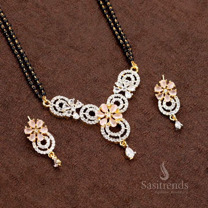 Royal pink AD pendant set featuring a circular floral design, a micro gold plated Mangalsutra chain, and matching earrings, perfect for a luxury jewellery collection - Sasitrends
