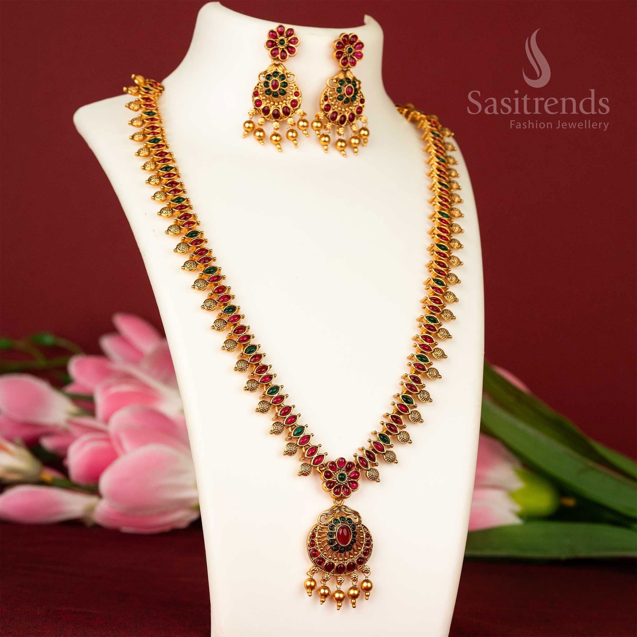 Temple flower haram necklace in ruby-green combination with matte gold finish – festive and rich traditional jewellery – sasitrends