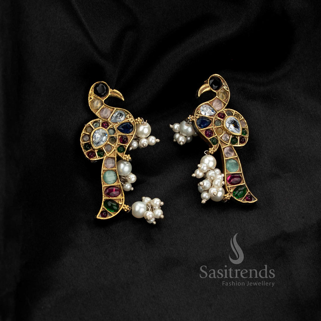 Striking antique oxidised dual-tone peacock earrings with pearl drop – Sasitrends
