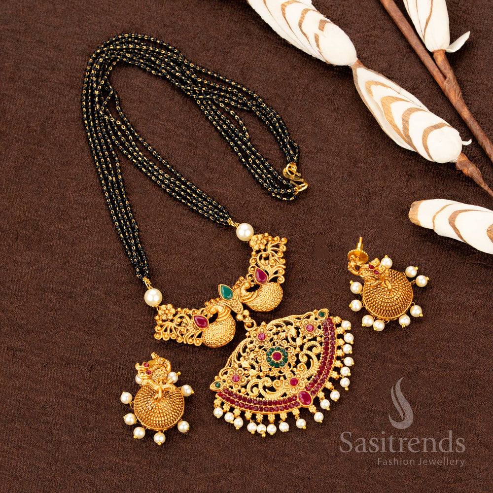 Temple-style matte gold necklace set featuring an ornate peacock and floral pendant, enhanced by matching jhumka earrings—crafted in rich South Indian festive jewellery tradition with intricate detailing - Sasitrends
