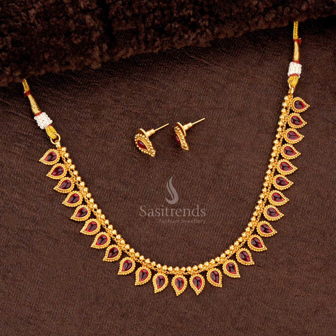 Traditional necklace set with ruby teardrop motifs and matching earrings, perfect for weddings and festive occasions - Sasitrends