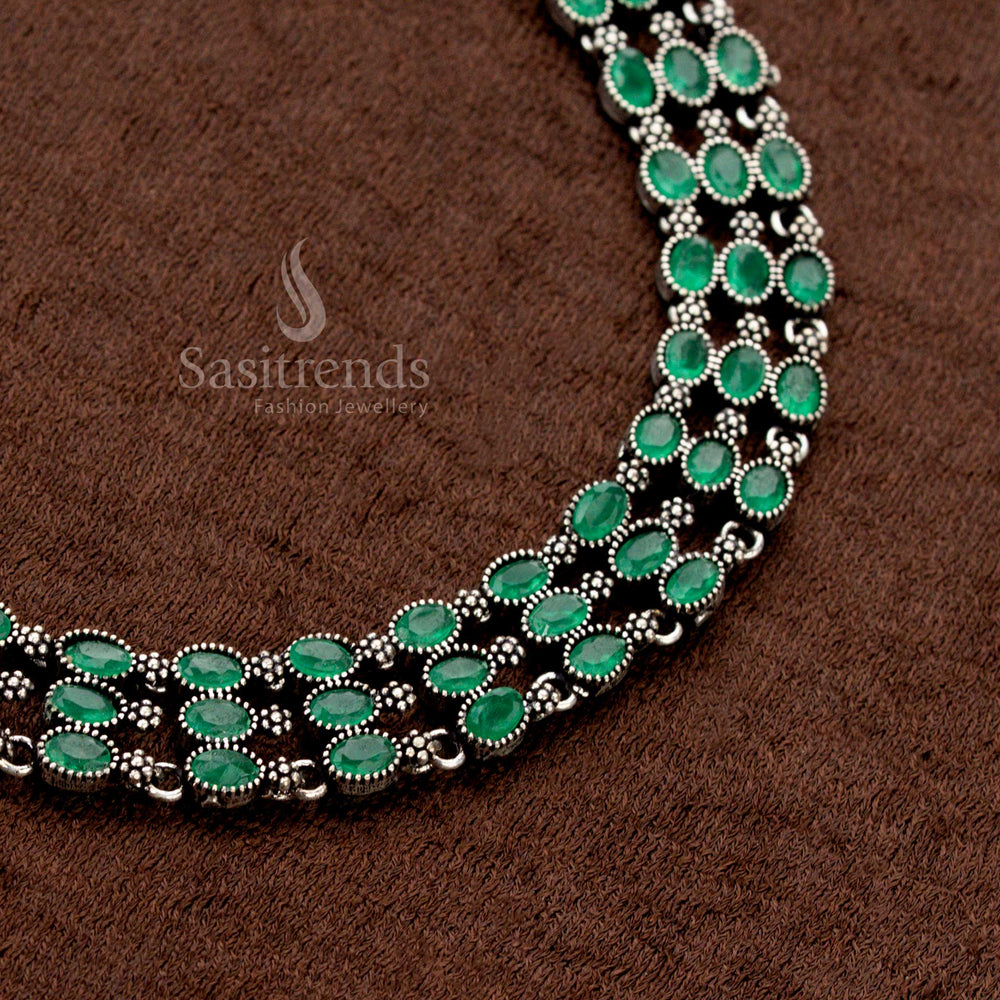 Oxidised metal necklace jewellery set with a three-layered design embellished with earthy green stones and delicate pearl jhumkas—merging rustic charm with royal Indian fusion aesthetics - Sasitrends