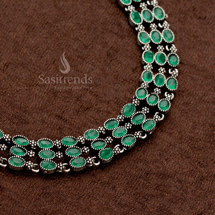 Oxidised metal necklace jewellery set with a three-layered design embellished with earthy green stones and delicate pearl jhumkas—merging rustic charm with royal Indian fusion aesthetics - Sasitrends