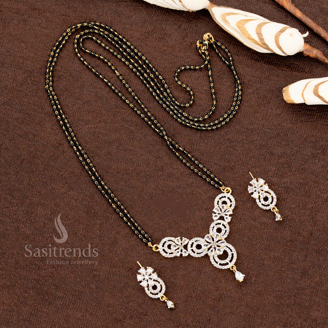 Exquisite white floral motif pendant set, adorned with American Diamonds, featuring a Mangalsutra chain and matching earrings, a timeless classic ethnic jewellery piece - Sasitrends