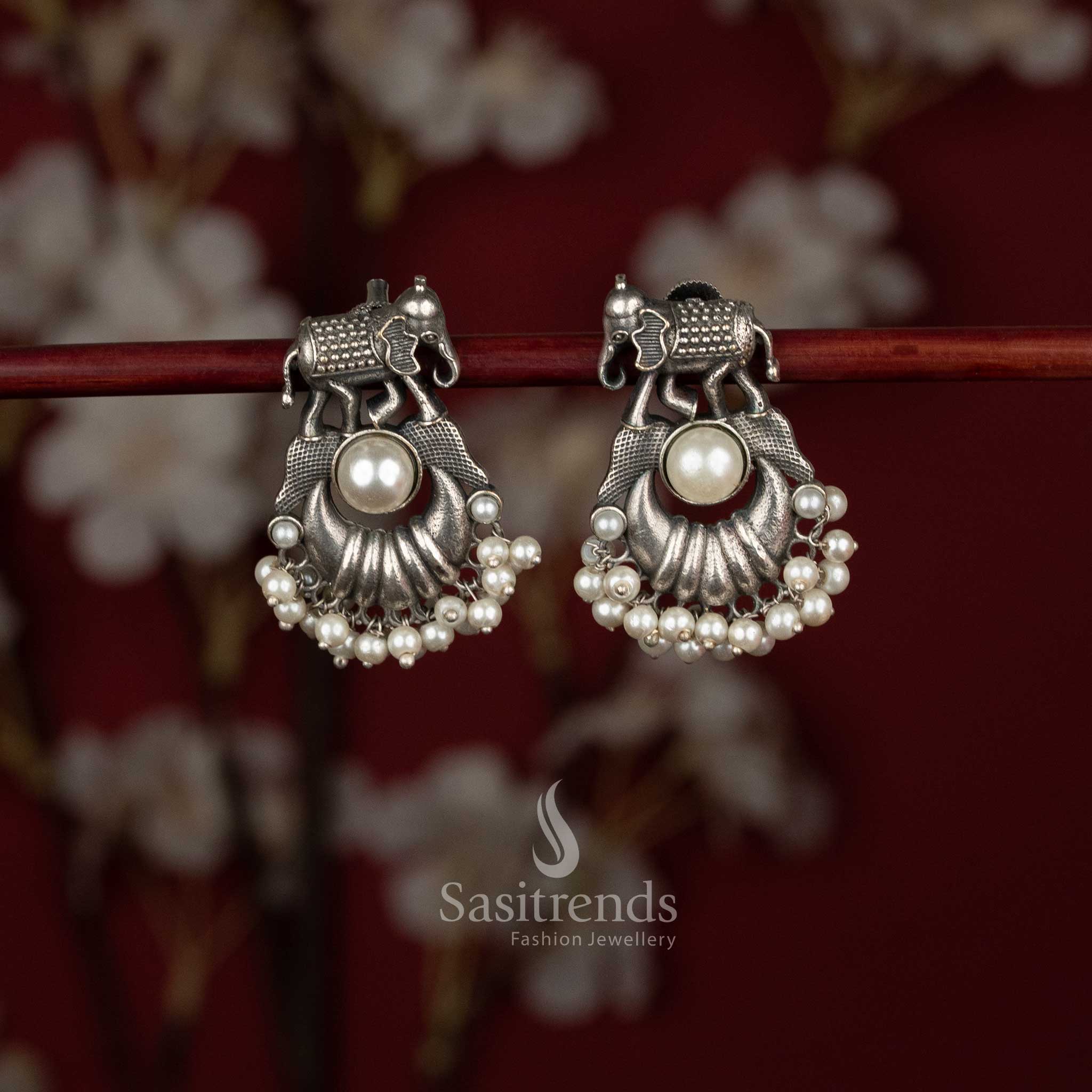 Oxidised German silver crescent earrings with elephant motif and pearl drops – Sasitrends