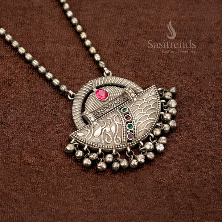 Traditional oxidised German silver pendant chain necklace in ruby-green with intricate engraved motifs and graceful hanging bead drops, perfect for ethnic charm – Sasitrends