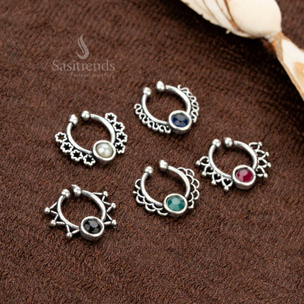 Pressable oxidised nosepin featuring stone drop detailing and tribal-inspired touch, infused with ancient elegance, traditional charm, and a gleaming silver-toned finish by Sasitrends
