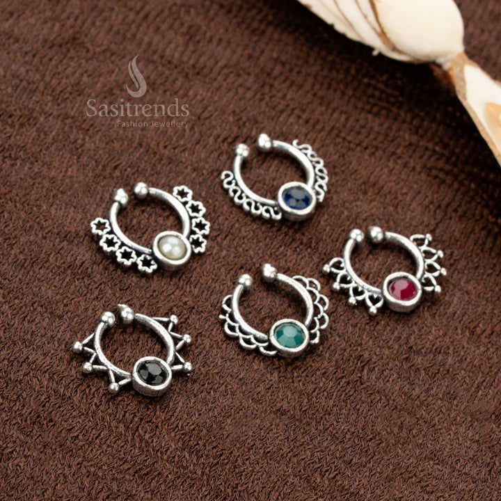 Pressable oxidised nosepin featuring stone drop detailing and tribal-inspired touch, infused with ancient elegance, traditional charm, and a gleaming silver-toned finish by Sasitrends