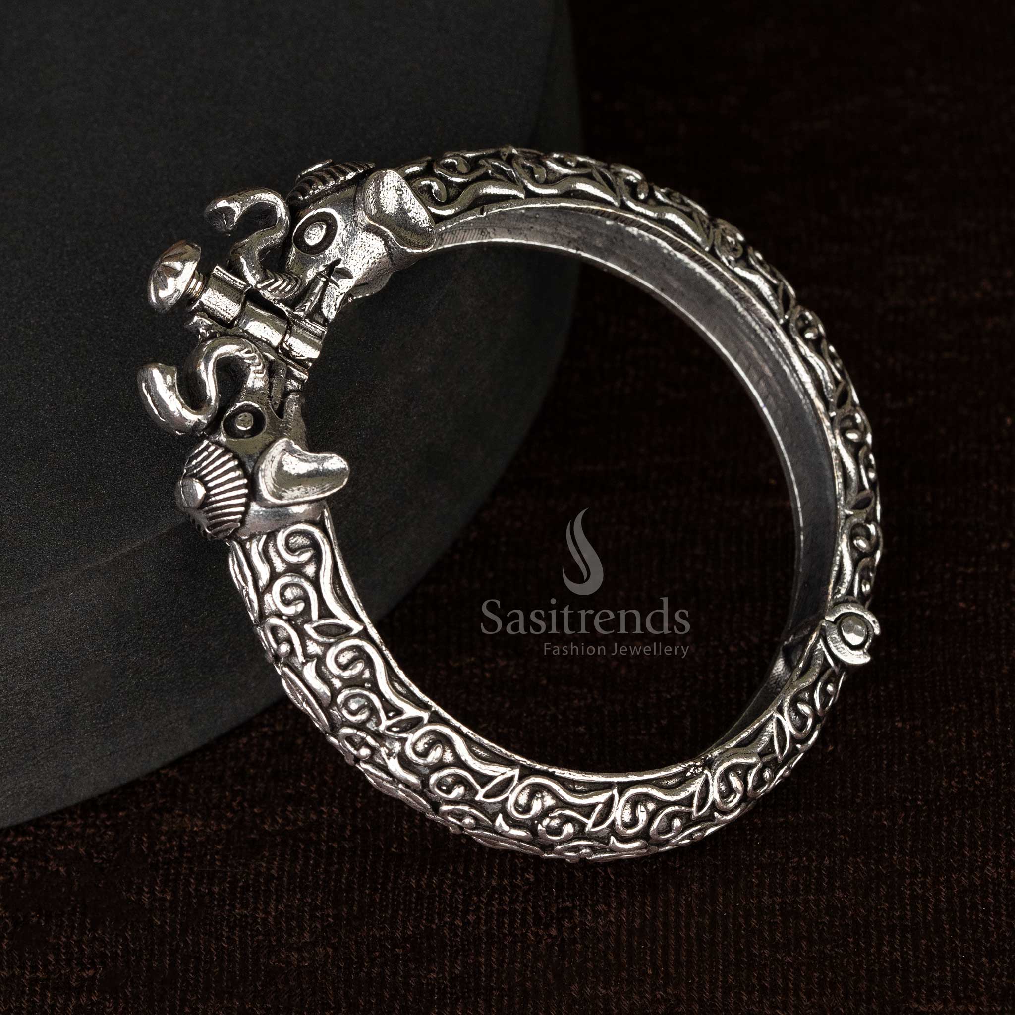A set of traditional oxidized openable kada bangles featuring ethnic floral and elephant designs - Sasitrends