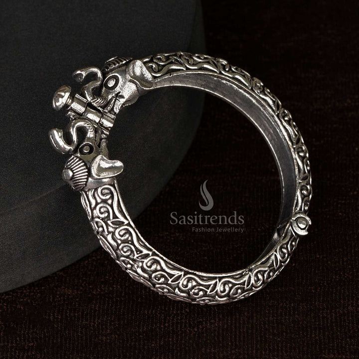 A set of traditional oxidized openable kada bangles featuring ethnic floral and elephant designs - Sasitrends
