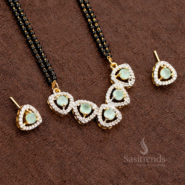 Premium mint-green American Diamond pendant set with a tri-petal drop design, paired with a micro gold plated Mangalsutra chain and matching earrings, a stunning ethnic jewellery piece - Sasitrends