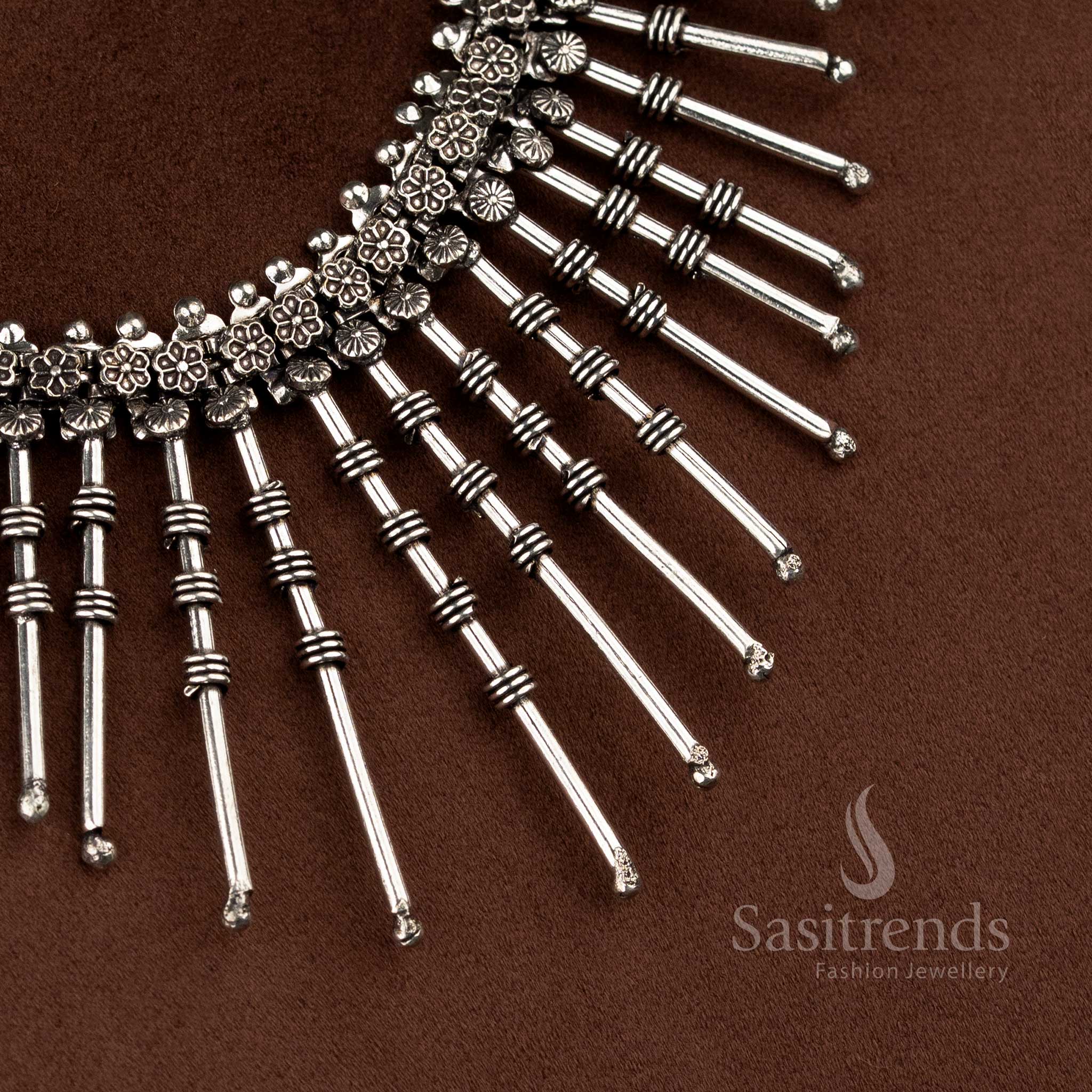 Floral engraved oxidised silver sunburst neckline necklace for festive wear