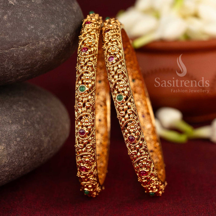 Front view of gold-plated bangles with flower design and Ruby & Green AD stones
