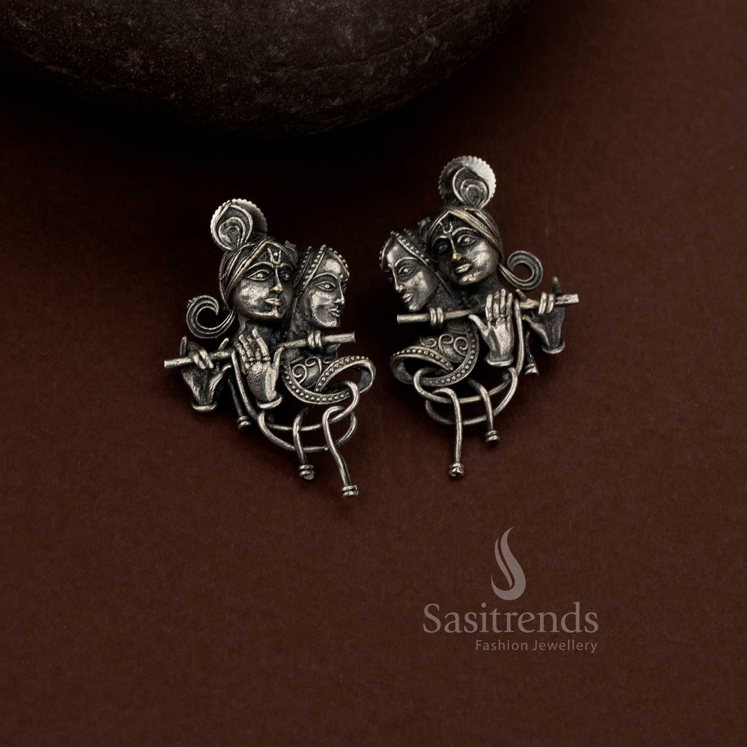 Sasitrends handcrafted oxidised silver plain Radha Krishna earrings with flowing art form