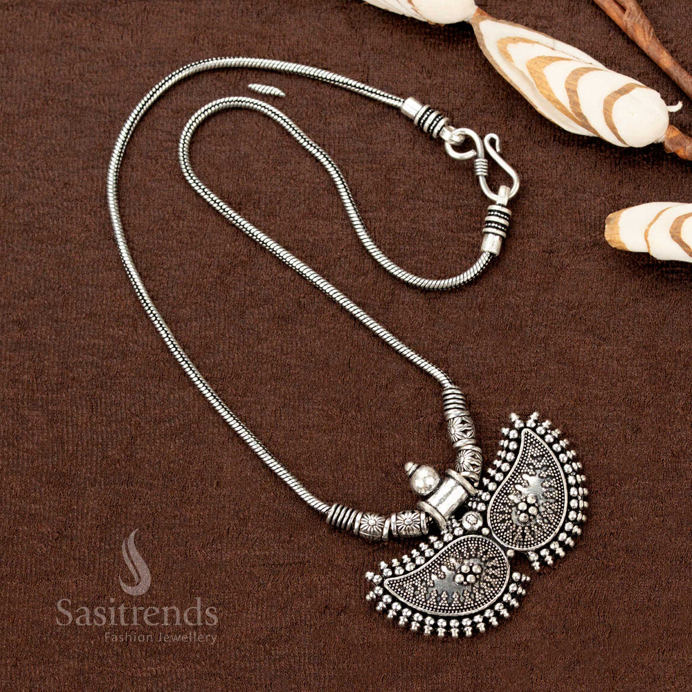 Royal oxidised silver chain necklace featuring intricately crafted dual paisley pendants in a vintage finish—an exquisite piece of traditional festive jewellery radiating timeless charm - Sasitrends