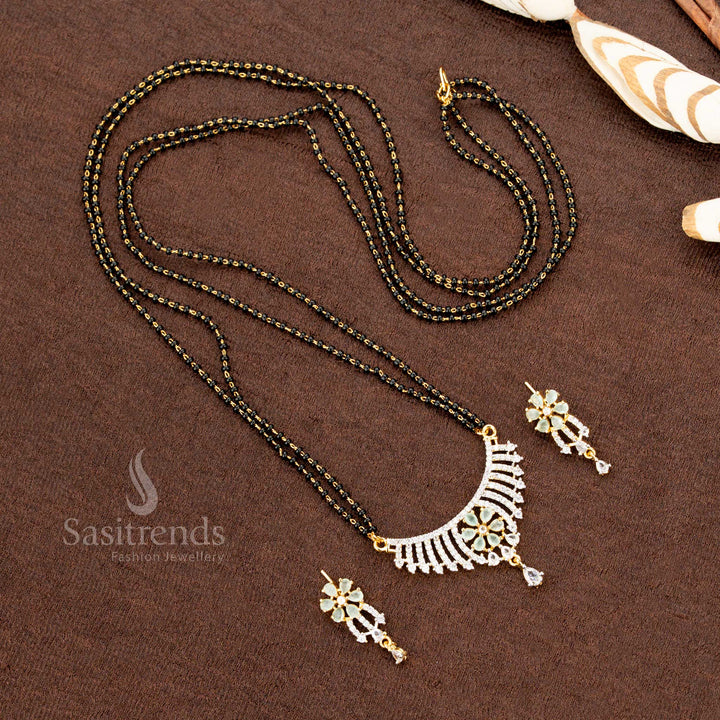 Premium mint-green American Diamond pendant set with a floral design, paired with a micro gold plated Mangalsutra chain and matching earrings, a stunning ethnic jewellery piece - Sasitrends