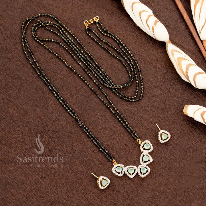 Exquisite mint-green tri-petal drop pendant set, crafted with sparkling American Diamonds and paired with a Mangalsutra chain, a classic and trendy jewellery piece - Sasitrends
