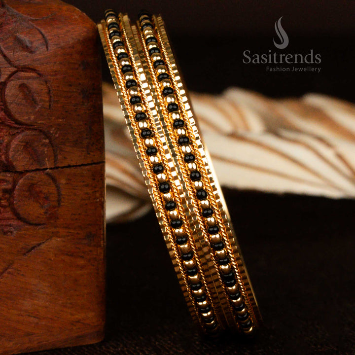 Elegant Indian-style micro gold plated black bead bangles for women designed with a dainty finish and vintage charm, ideal for traditional ensembles – exclusive designer jewellery from Sasitrends