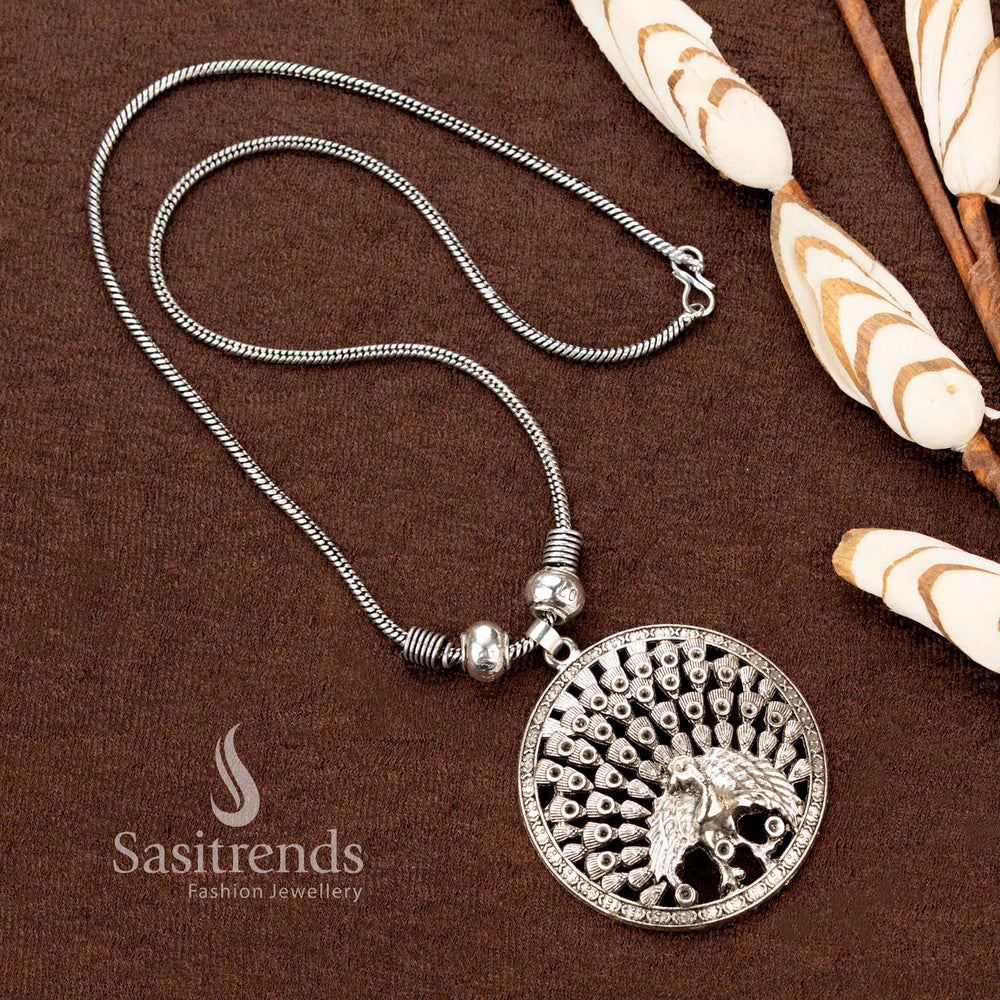 Regal oxidised silver chain necklace with full peacock pendant showcasing intricate detailing, a statement piece of heritage-inspired traditional jewellery perfect for Navaratri occasions - Sasitrends