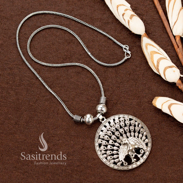 Regal oxidised silver chain necklace with full peacock pendant showcasing intricate detailing, a statement piece of heritage-inspired traditional jewellery perfect for Navaratri occasions - Sasitrends