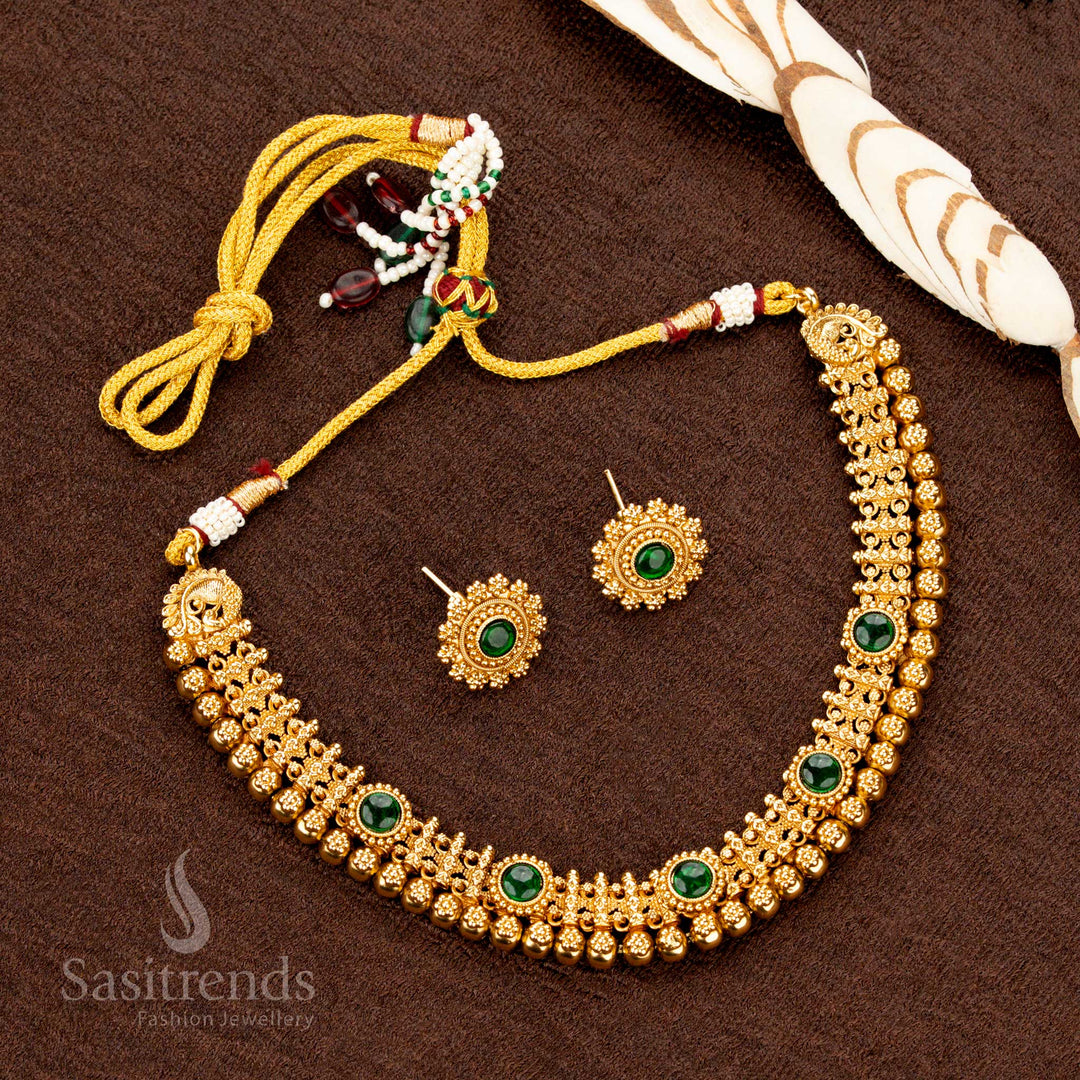 Exquisite handcrafted antique gold necklace set with green AD stones, bold beads, and a traditional charm, ideal for weddings, festivals, and special events - Sasitrends