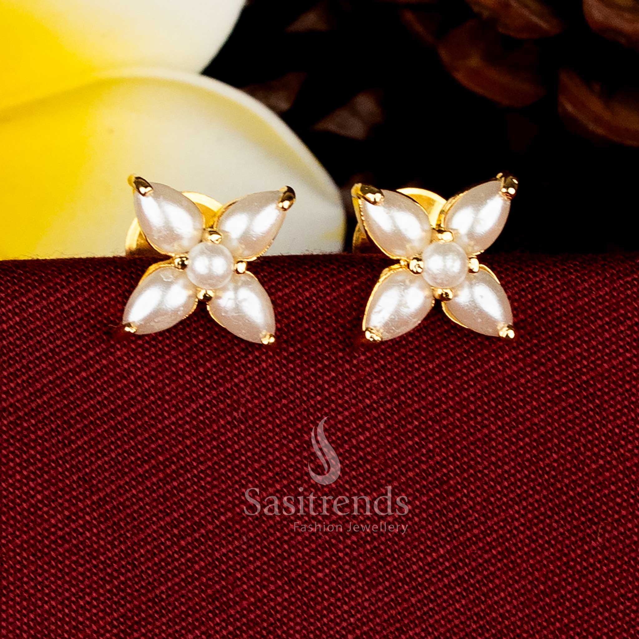 Four-petal floral pearl AD stone studs for mehendi and festive styling Sasitrends