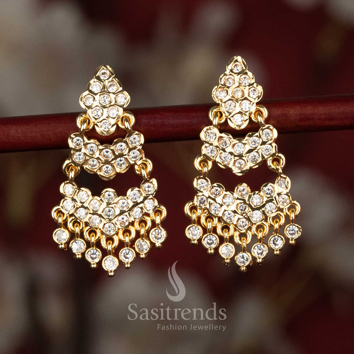 Elegant impon micro gold plated diamond cut stud earrings with dual layer arch and ad stones white colour for traditional festive wear -Sasitrends