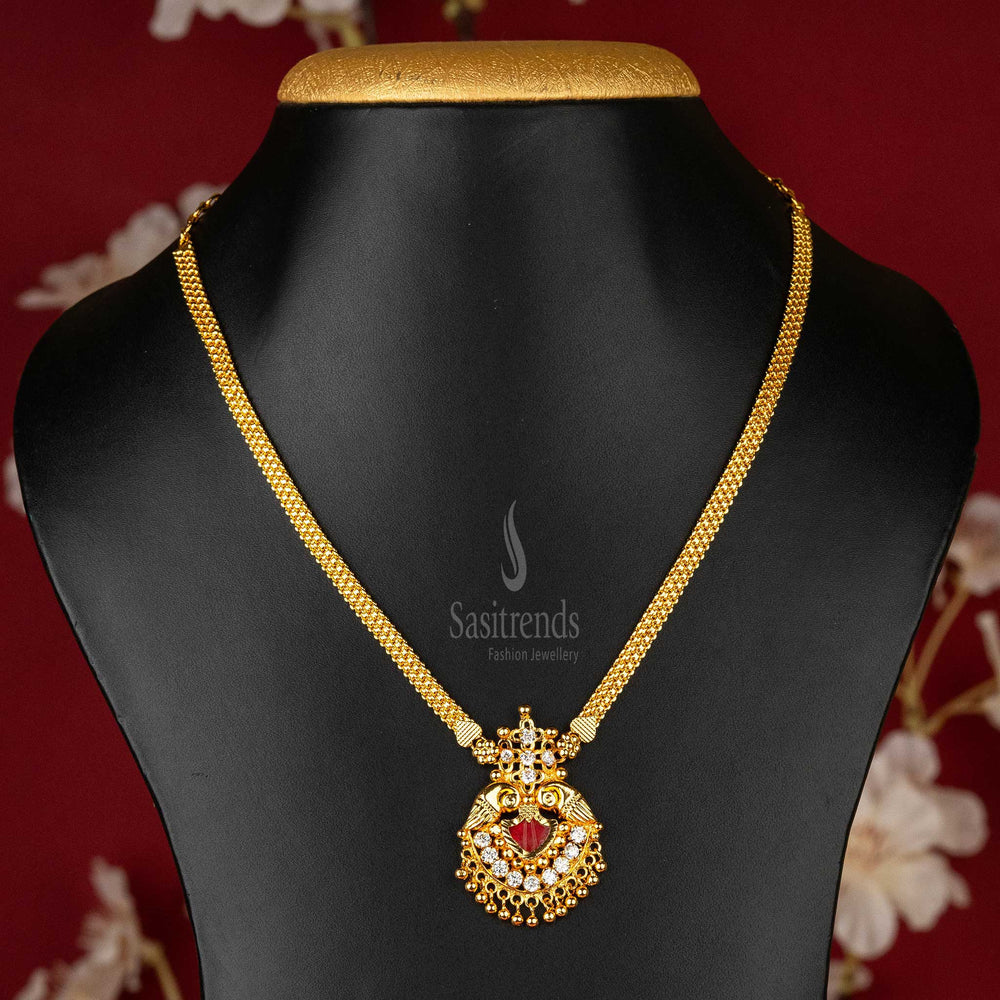 Kerala Heritage Palakka Pendant Necklace with Gleaming White Stones, Peacock Design, and Gold Ball Details