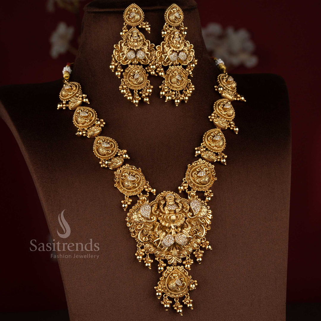 Wonderful white premium matte gold plated temple dual peacock with Goddess Lakshmi necklace jewellery set crafted for wedding ceremonies and sacred traditional occasions – Sasitrends