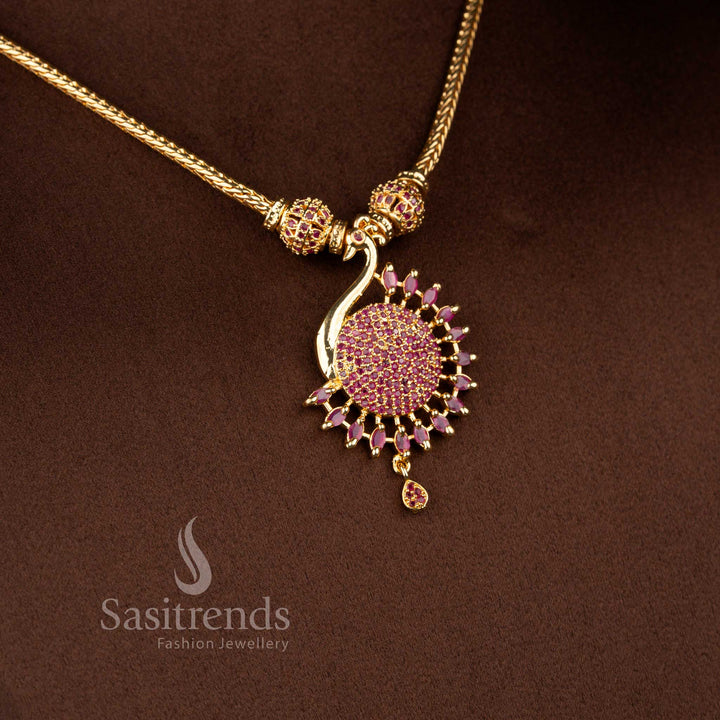 Majestic micro gold plated peacock necklace in deep ruby with intricate gemstone work and pearl highlights for bridal or festive ensembles – Sasitrends