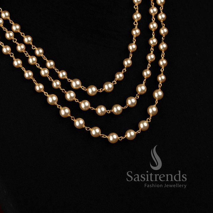 Sasitrends Micro Gold Plated three-strand necklace featuring evenly spaced round pearls and gold-tone links 
