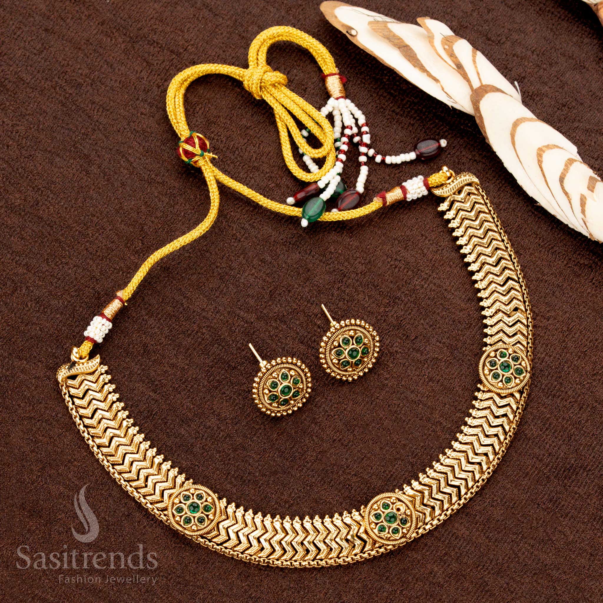 Heritage-style antique finish necklace set featuring green AD stones with intricate round floral accents, an ideal jewellery piece for grand occasions - Sasitrends