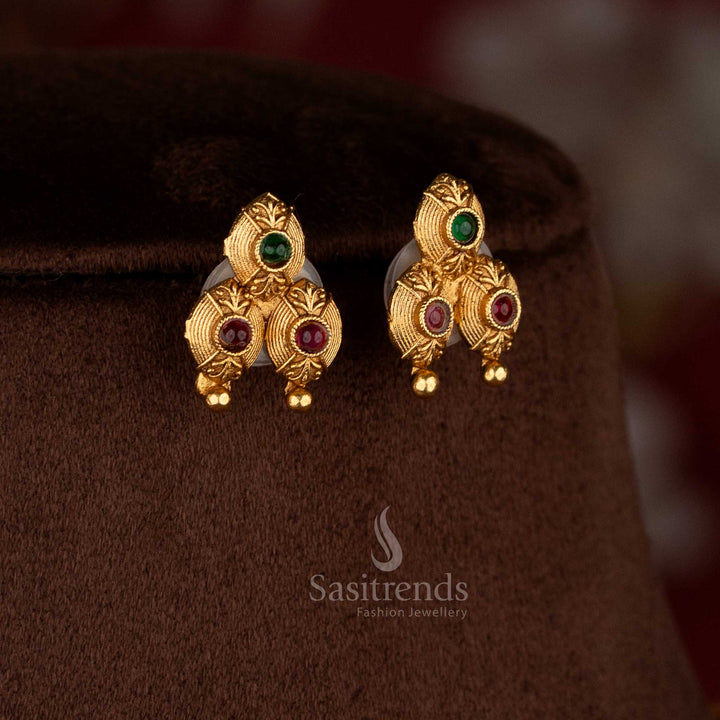 Alluring classic matte gold plated ruby-green carved stone earrings with heritage finishing – Sasitrends