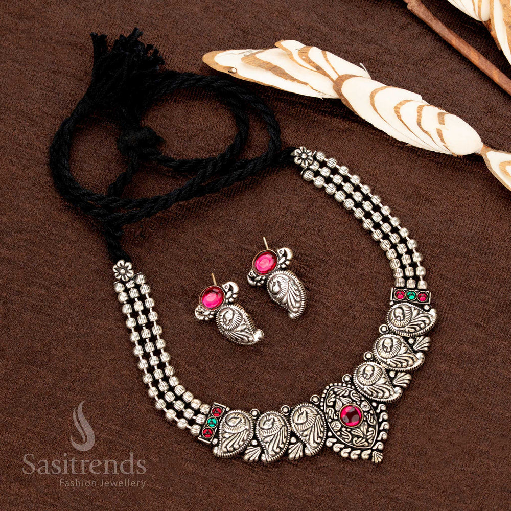 Traditional festive jewellery set with oxidised finish and red stone detailing - Sasitrends