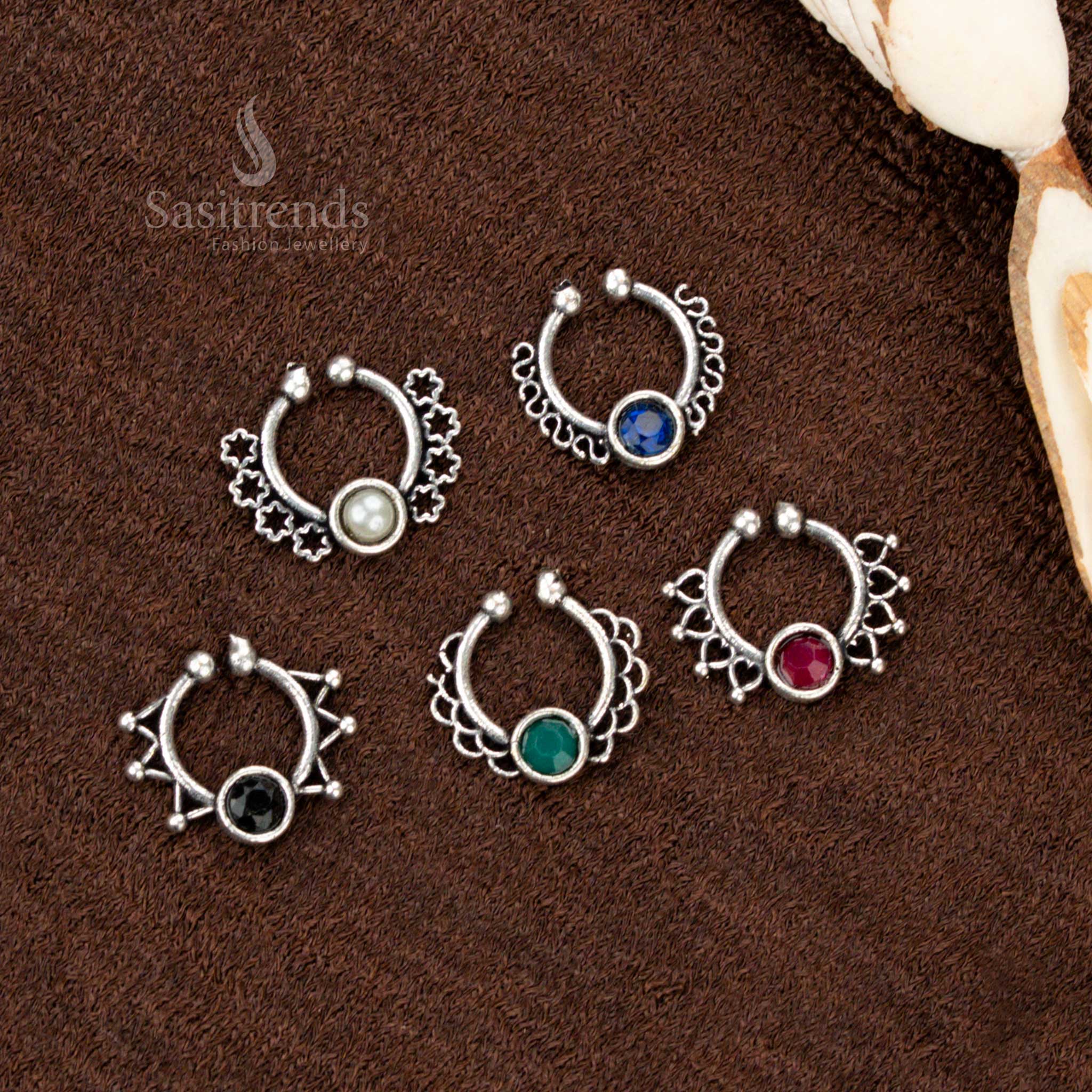Traditional oxidised stone nosepin with a press-fit design featuring a stylish leaf motif, finished in rustic glow and handcrafted for heritage elegance by Sasitrends